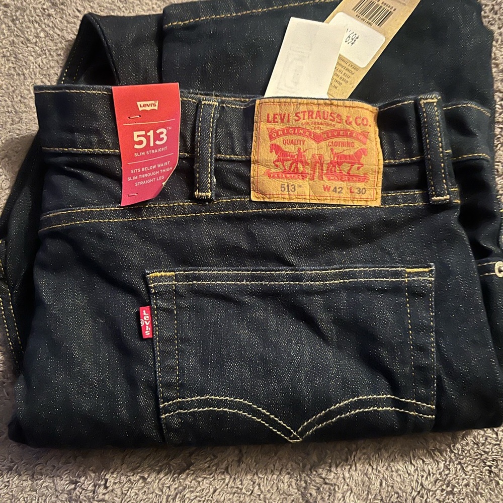 Levi’s, dark blue 513 Slim Straight jeans. NWT 42x30
